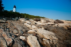 Burnt Island Lighthouse Tower by Rocky Shoreline in Maine